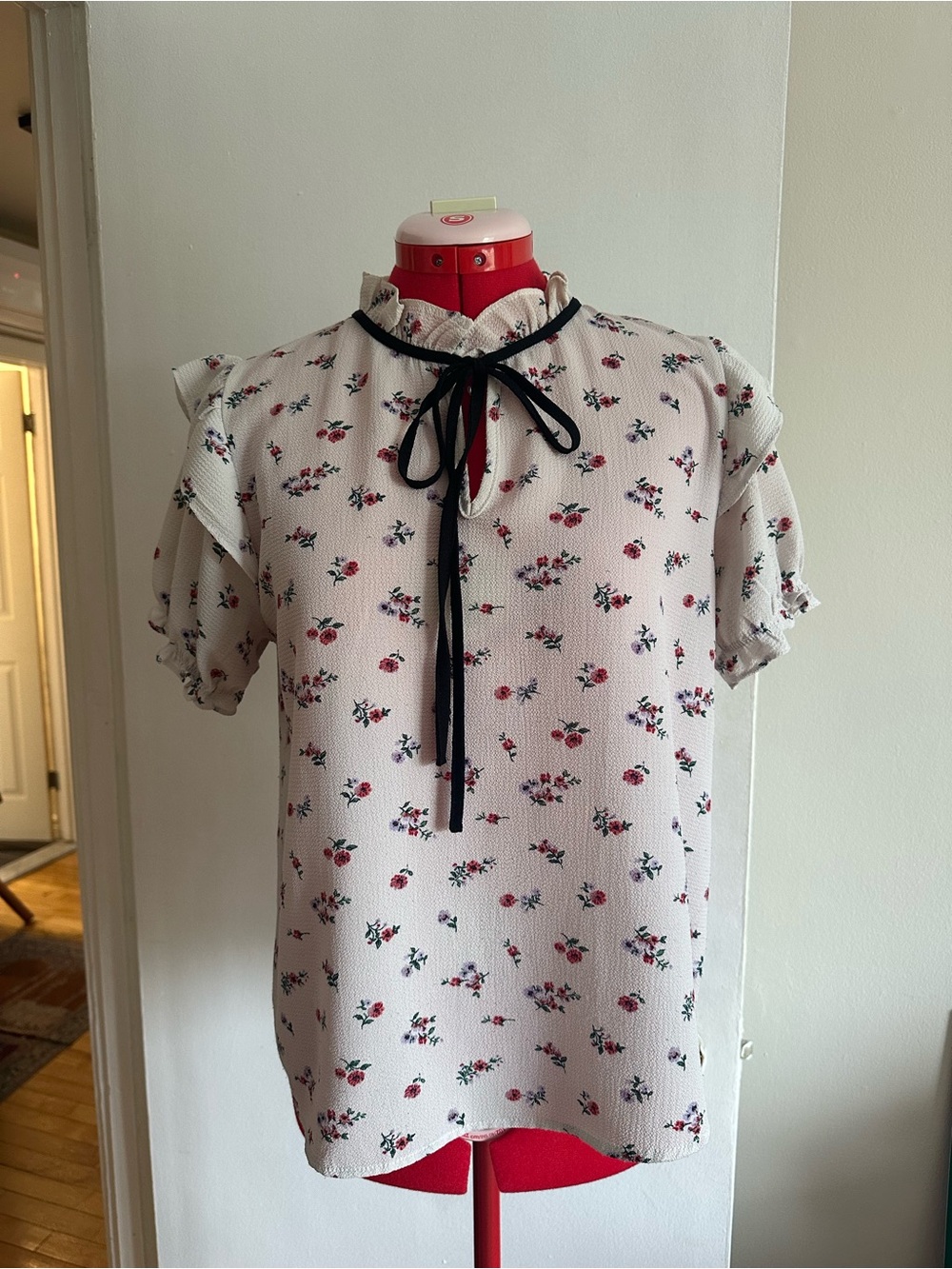 Active USA Cream Floral Ruffle Blouse with Black Ribbon Accent